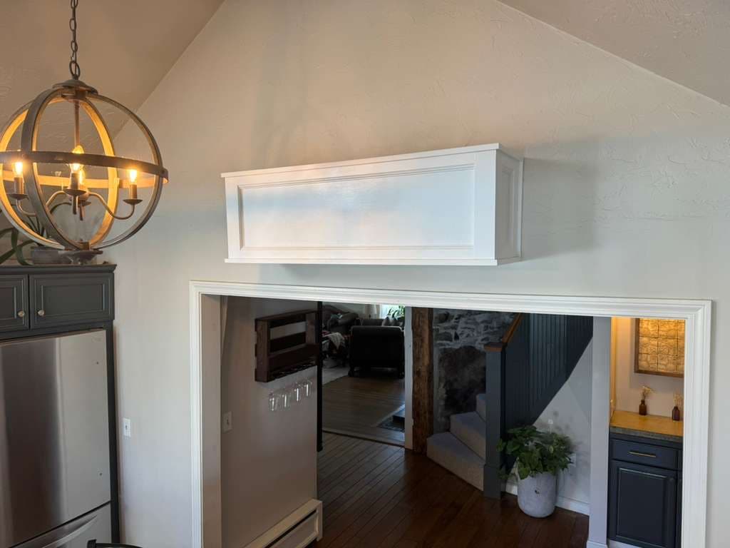 Long mini-split cover spanning a wide doorway